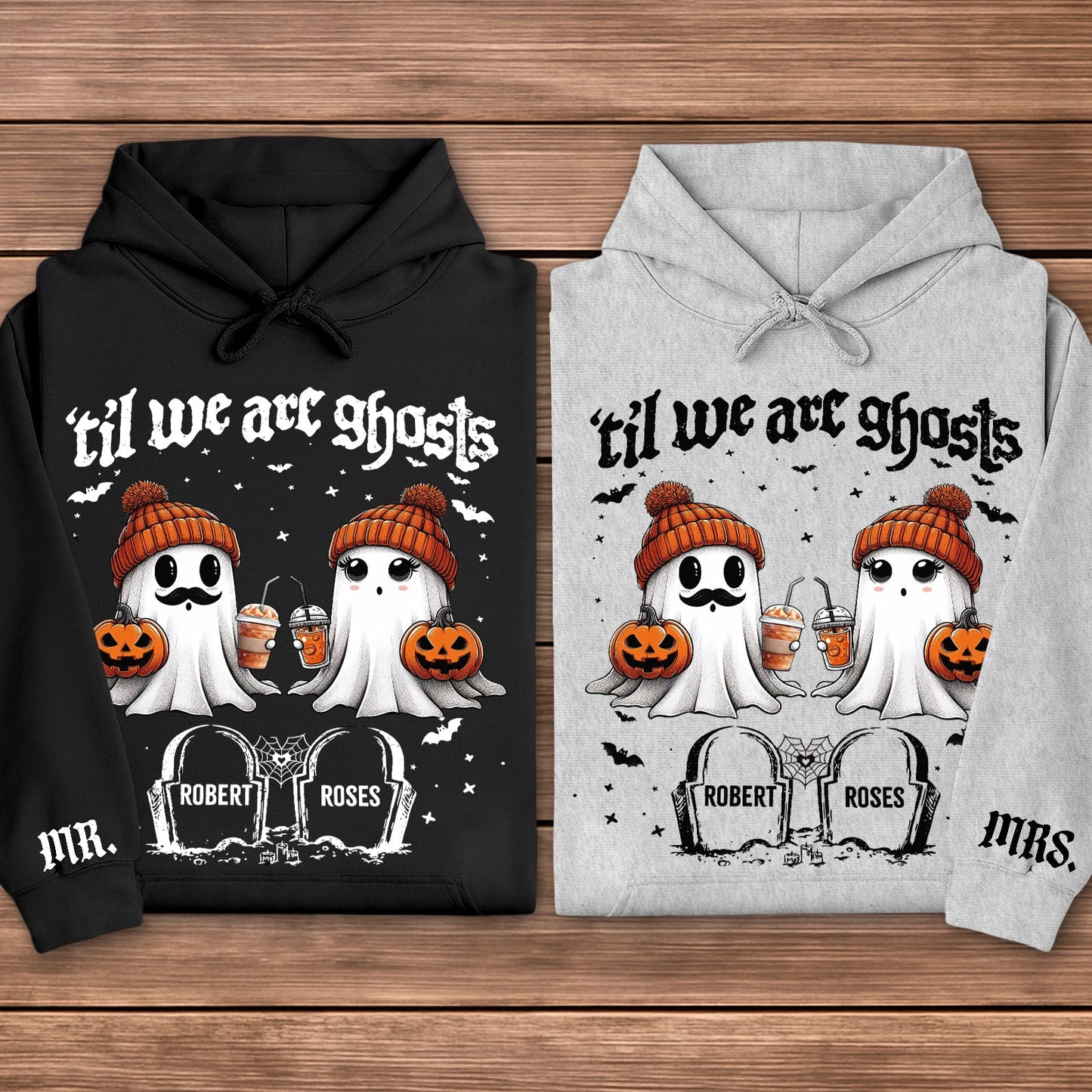 Black and gray hoodies personalized Halloween couple shirt featuring two cute ghosts in orange beanies holding pumpkins and drinks