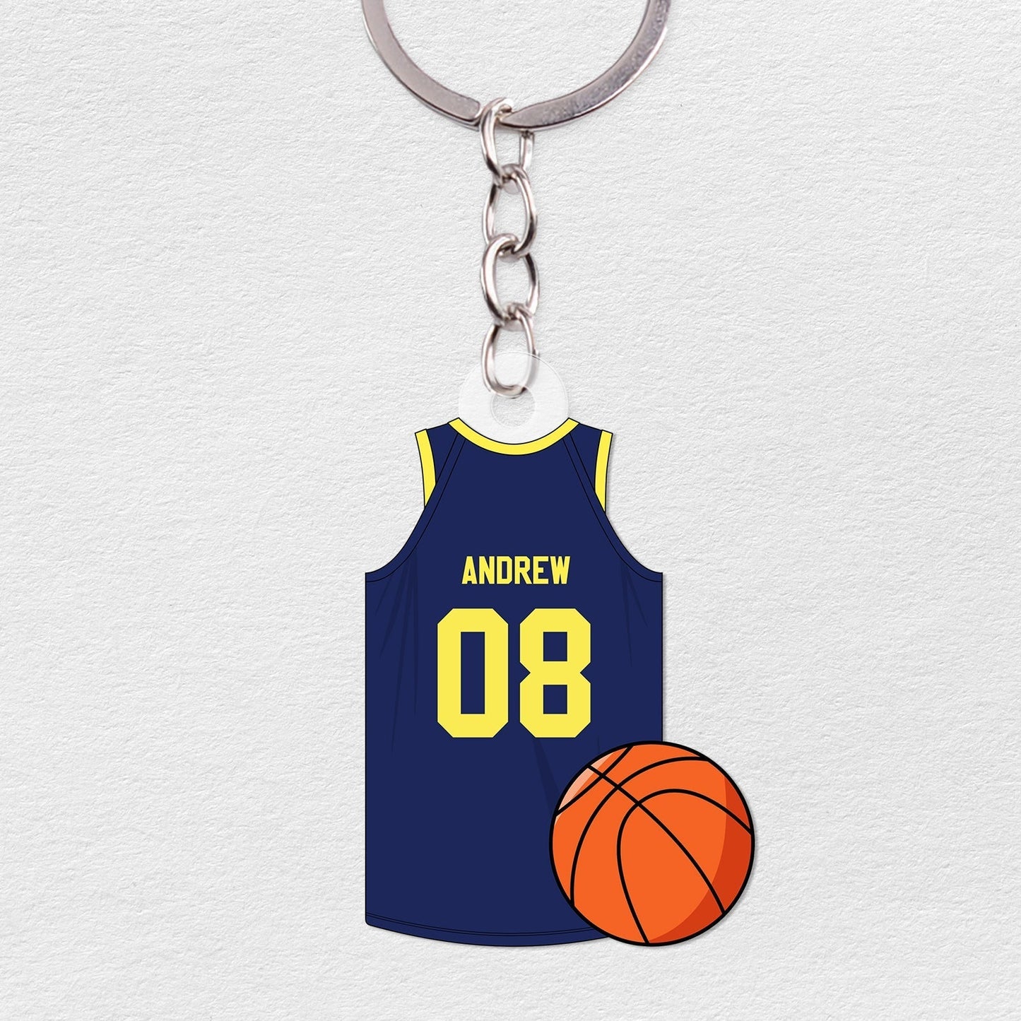 Personalized basketball jersey keychain featuring a blue jersey with name and number and a basketball