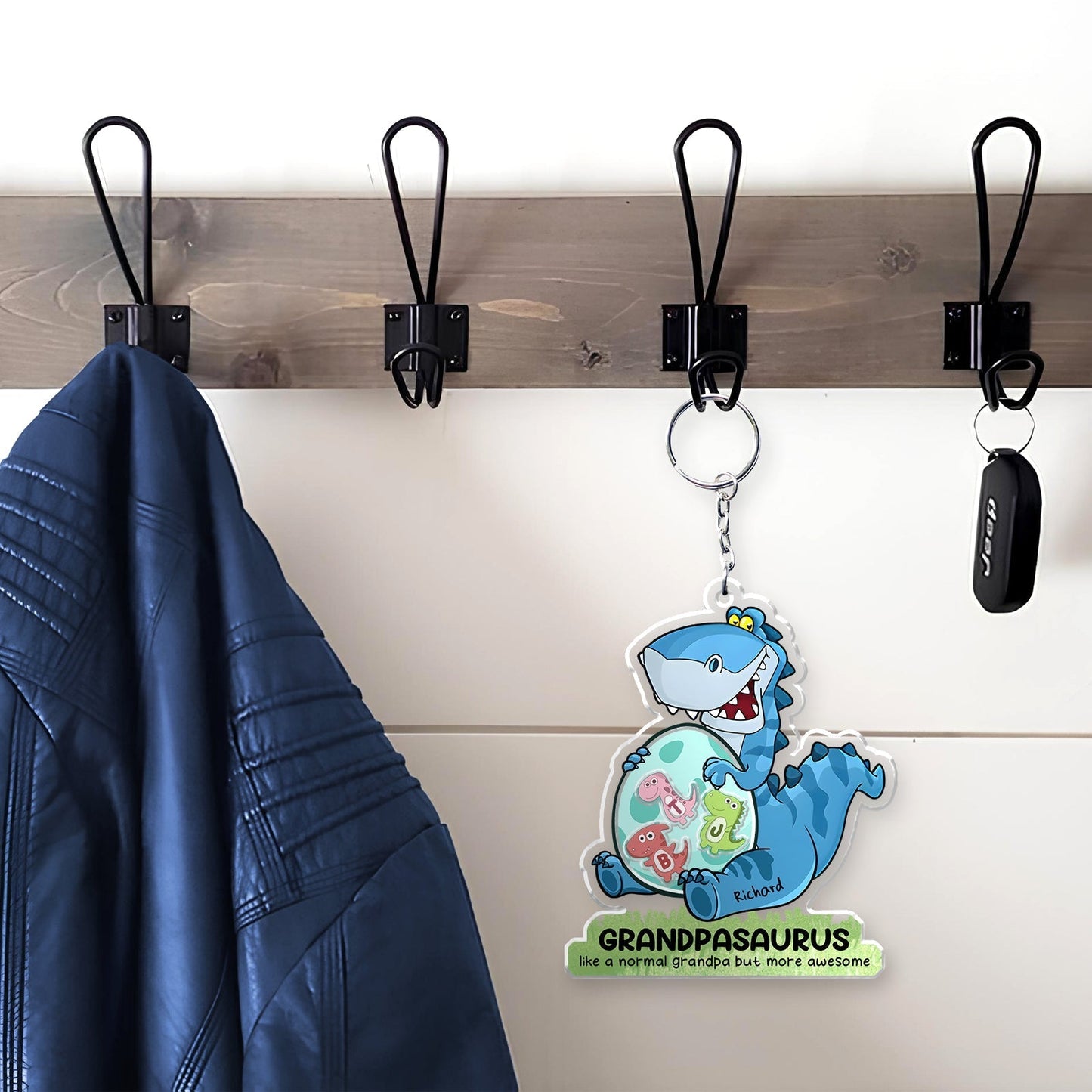 Personalized grandpa keychain featuring a fun dinosaur design, perfect for keys or bags