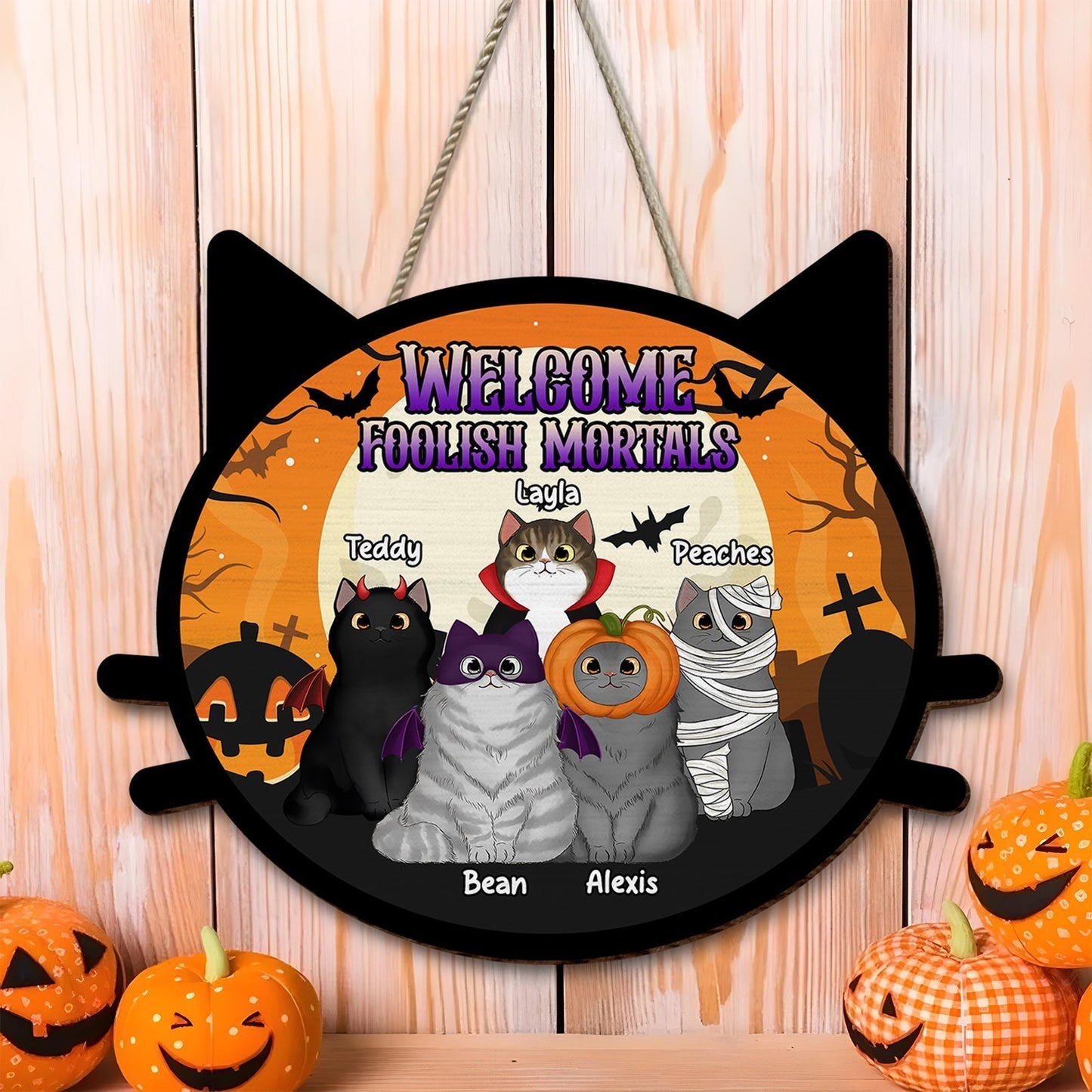 Personalized pet door sign featuring cartoon cats in costumes for Halloween decor