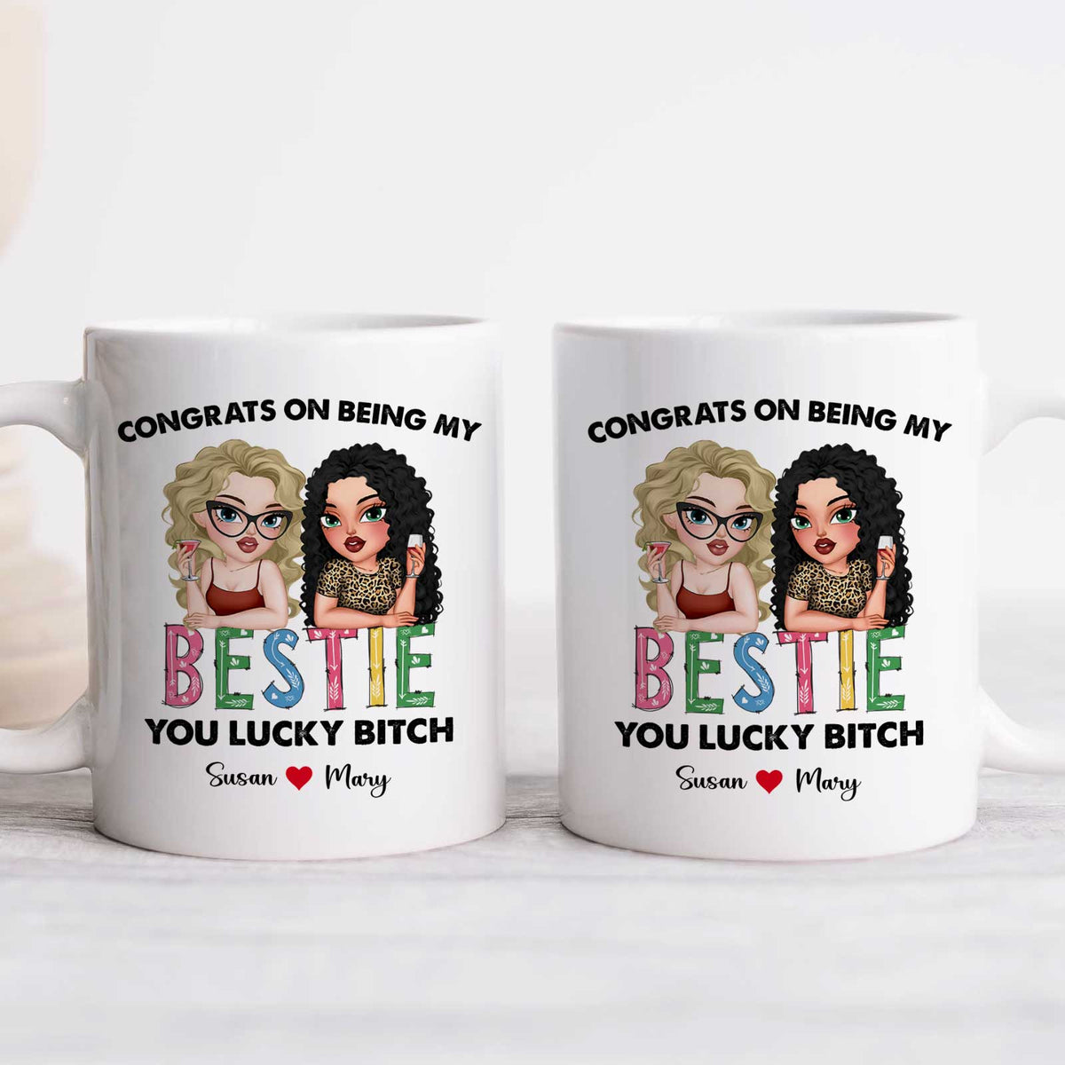Two white mugs reading Congrats on being my BESTIE with cartoon friends and names Susan and Mary custom bestie gift