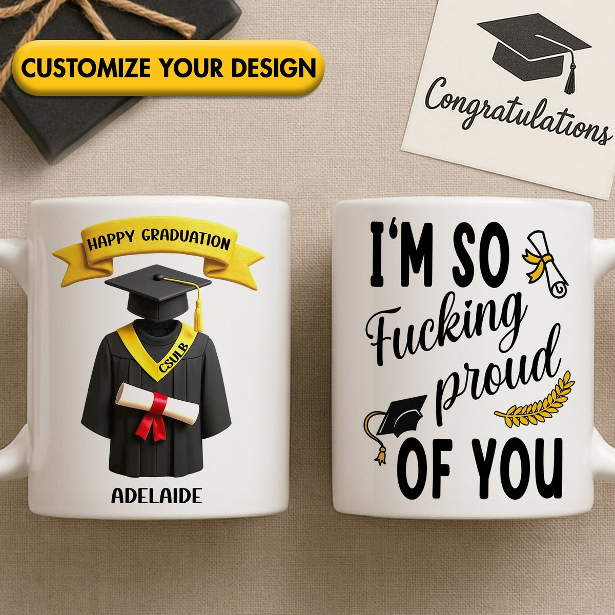 Two white ceramic custom graduation gift mug set showing graduate cap and gown design and bold proud message