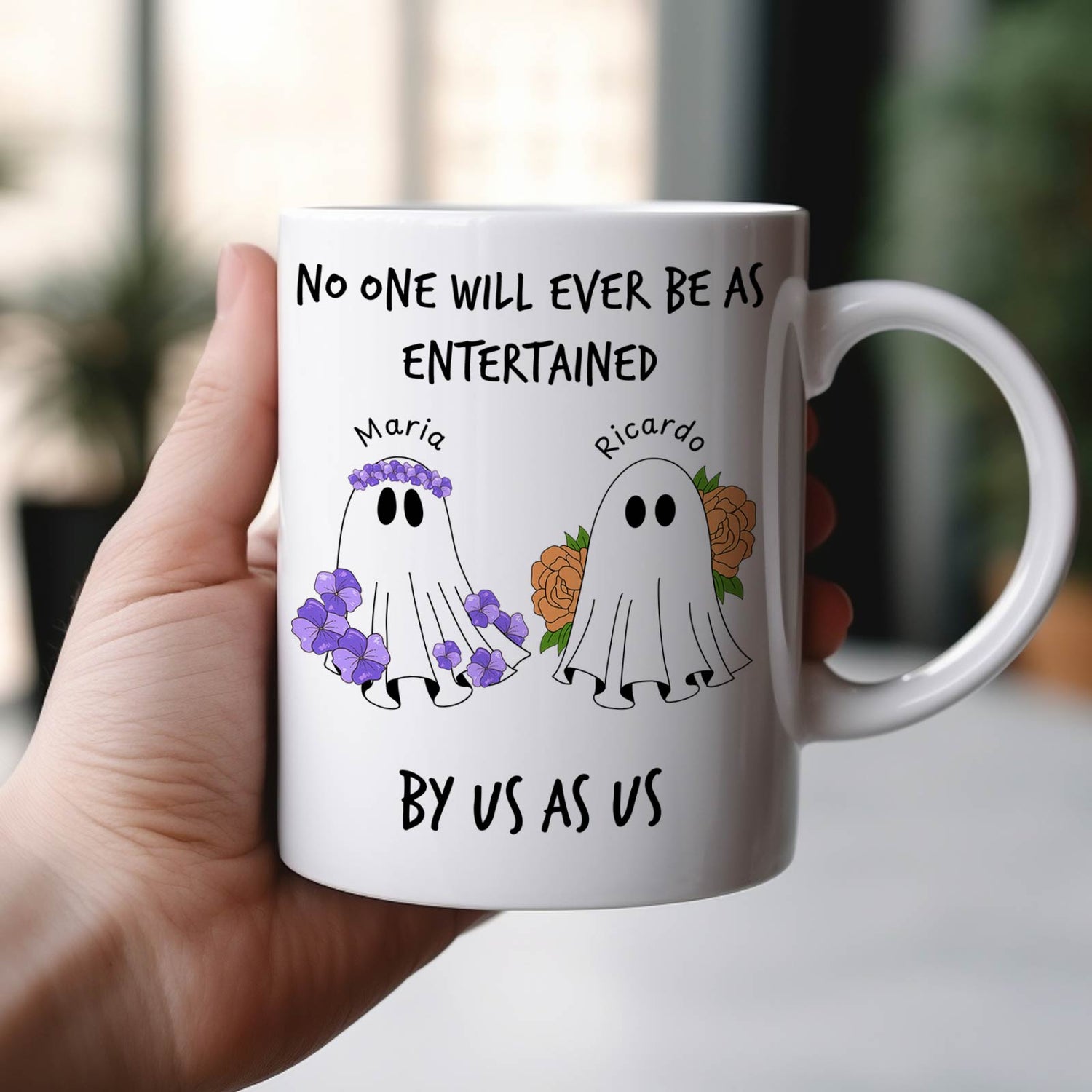 personalized Halloween ghost mug white ceramic with two named floral ghosts Maria and Ricardo held in hand