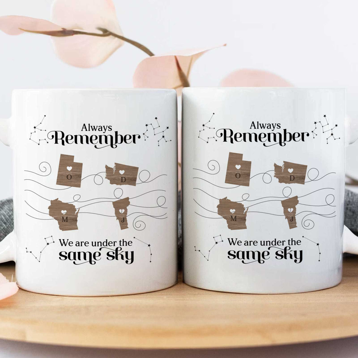 Pair of matching ceramic mugs with map hearts and constellations Always Remember design unique gift for long distance friends