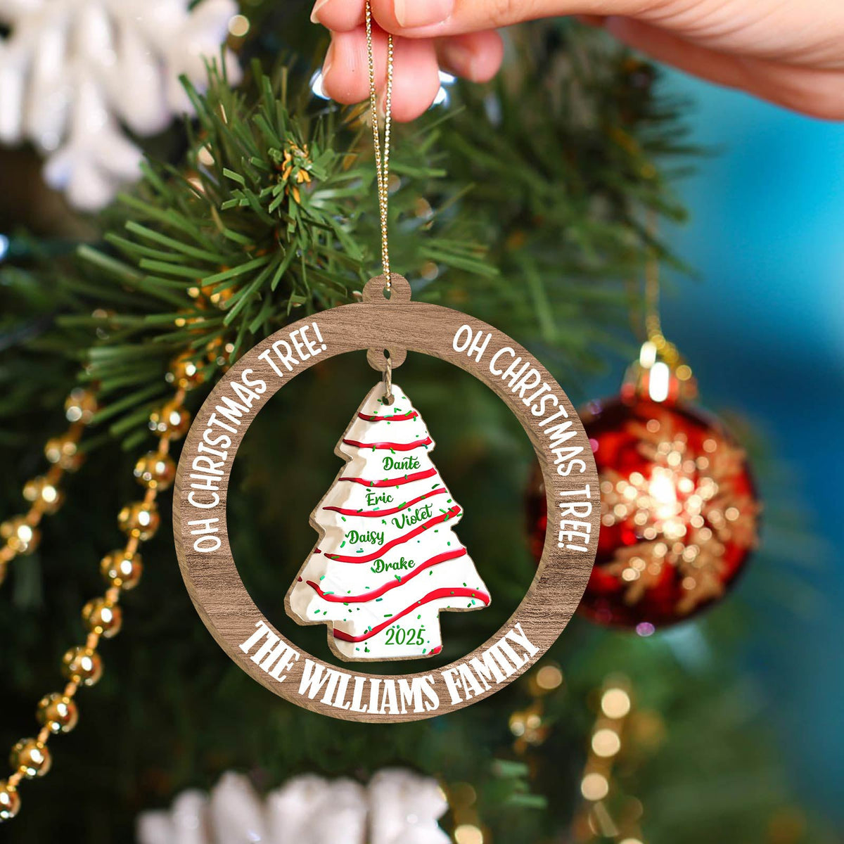 Personalized family Christmas ornament featuring a decorated tree with names for holiday celebrations