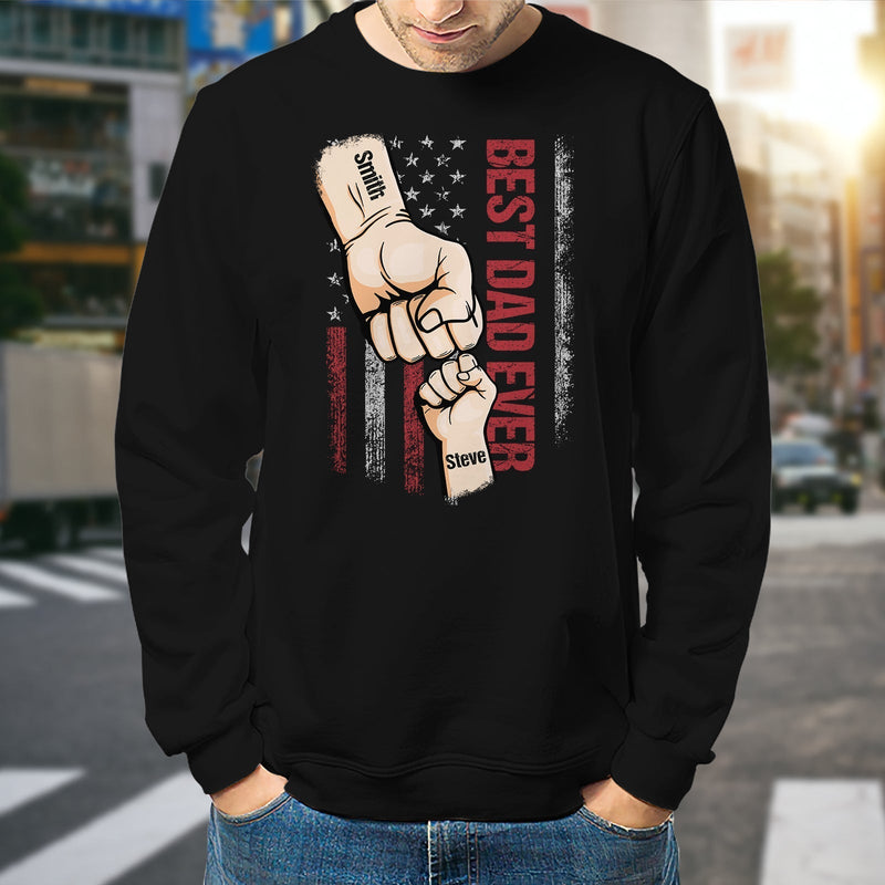 Black sweatshirt featuring best dad ever custom t-shirt design with fist bump and American flag