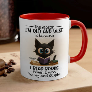 Red rim ceramic mug with wide eyed black cat reading books and quote name Victor funny personalized accent mug for bookworms