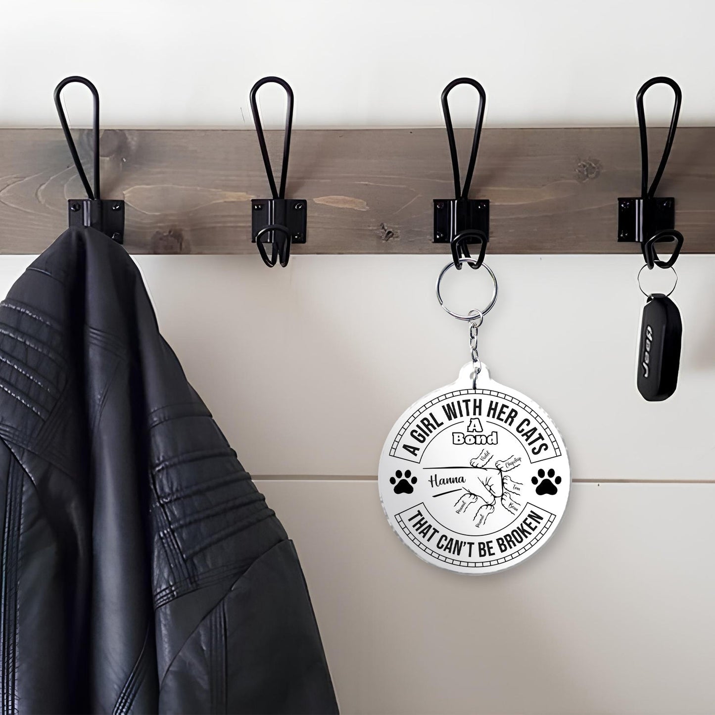 Cat lover keychain featuring a design that celebrates the bond between a girl and her cats