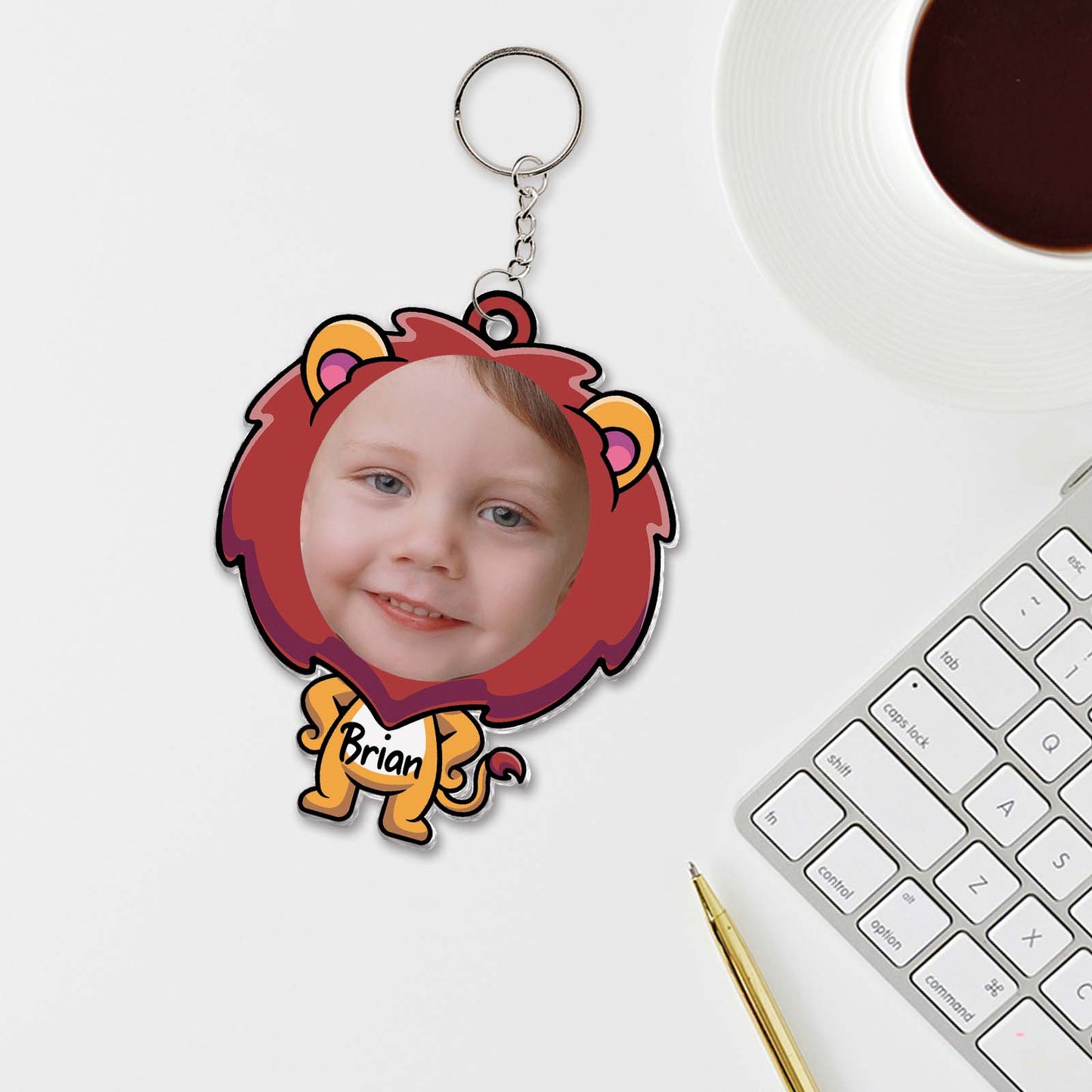 Custom acrylic photo keychain featuring a child's face with a lion design and name tag