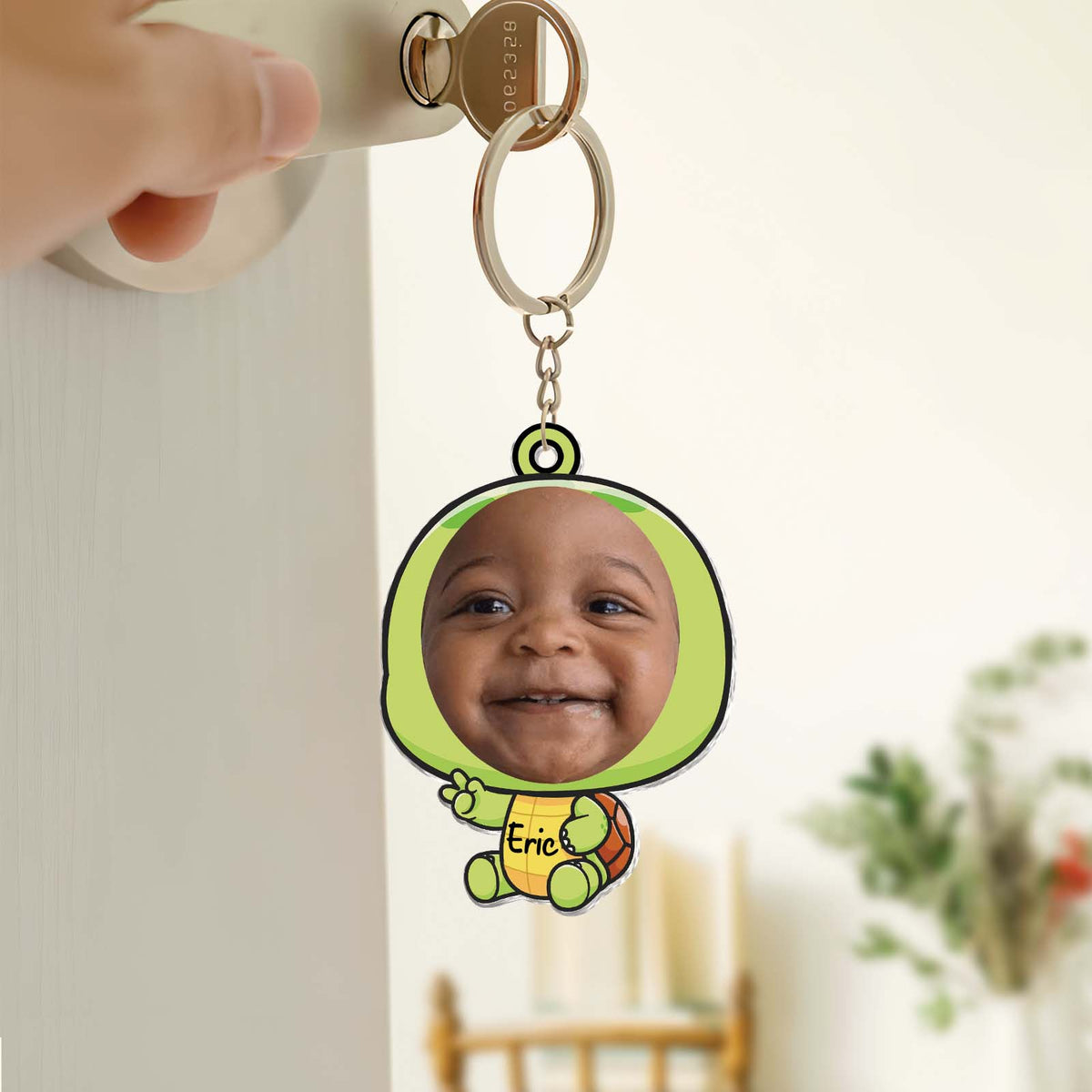 Custom acrylic photo keychain featuring a smiling baby in a colorful design