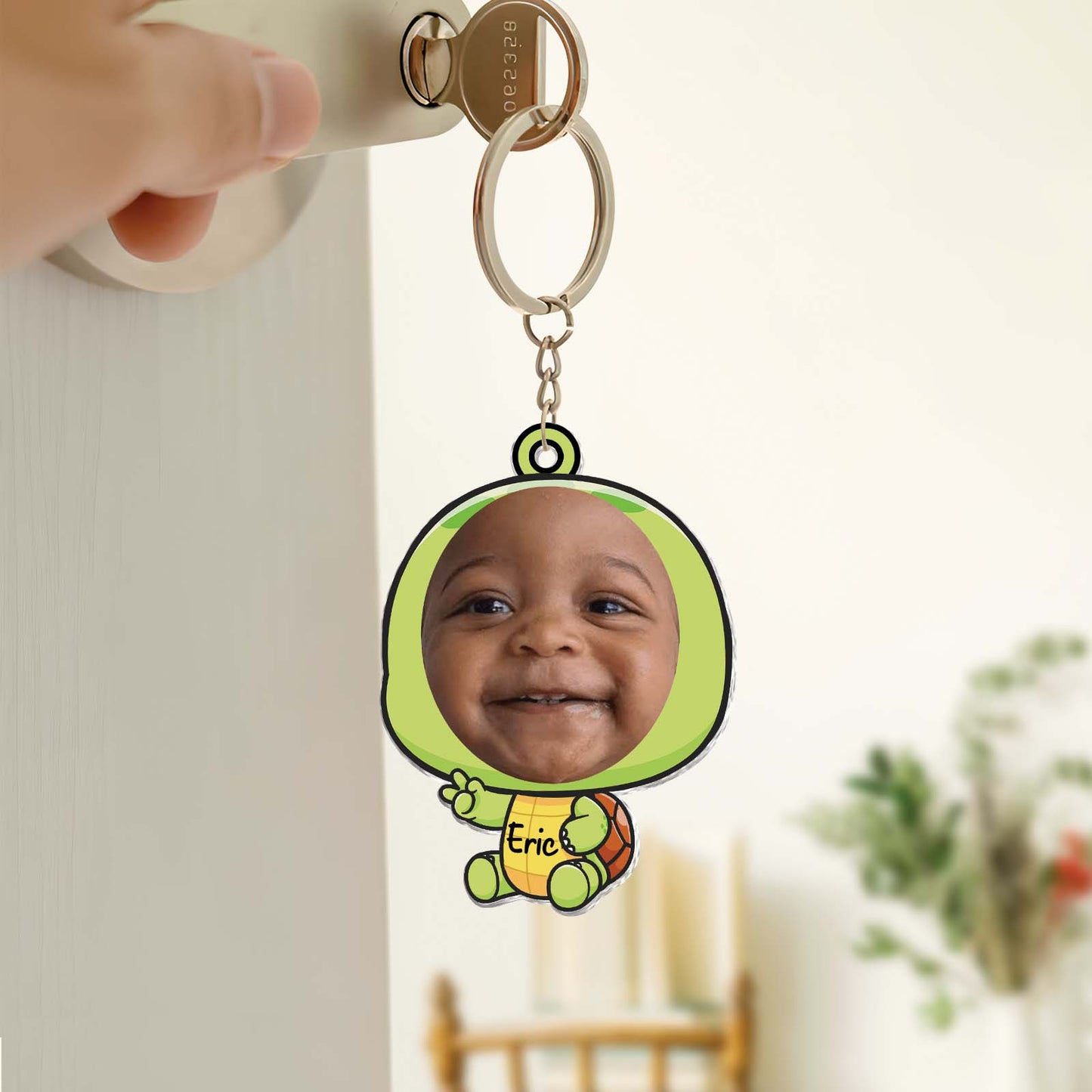Custom acrylic photo keychain featuring a smiling baby in a colorful design