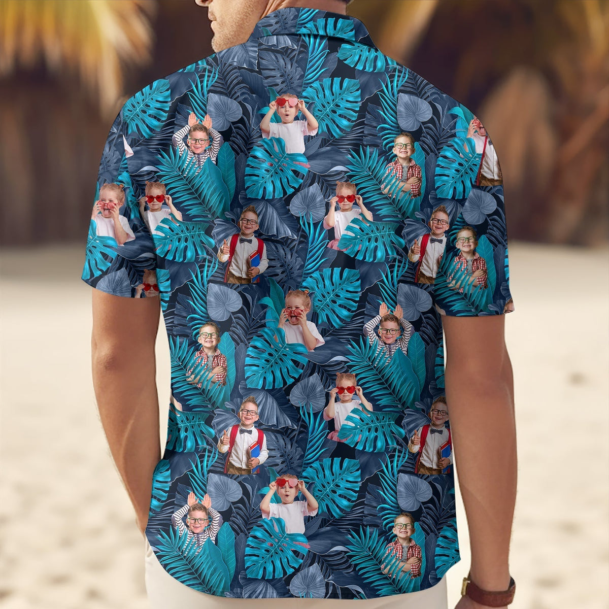 Custom blue tropical linen shirt with vibrant leaf pattern and personalized photo design on beach