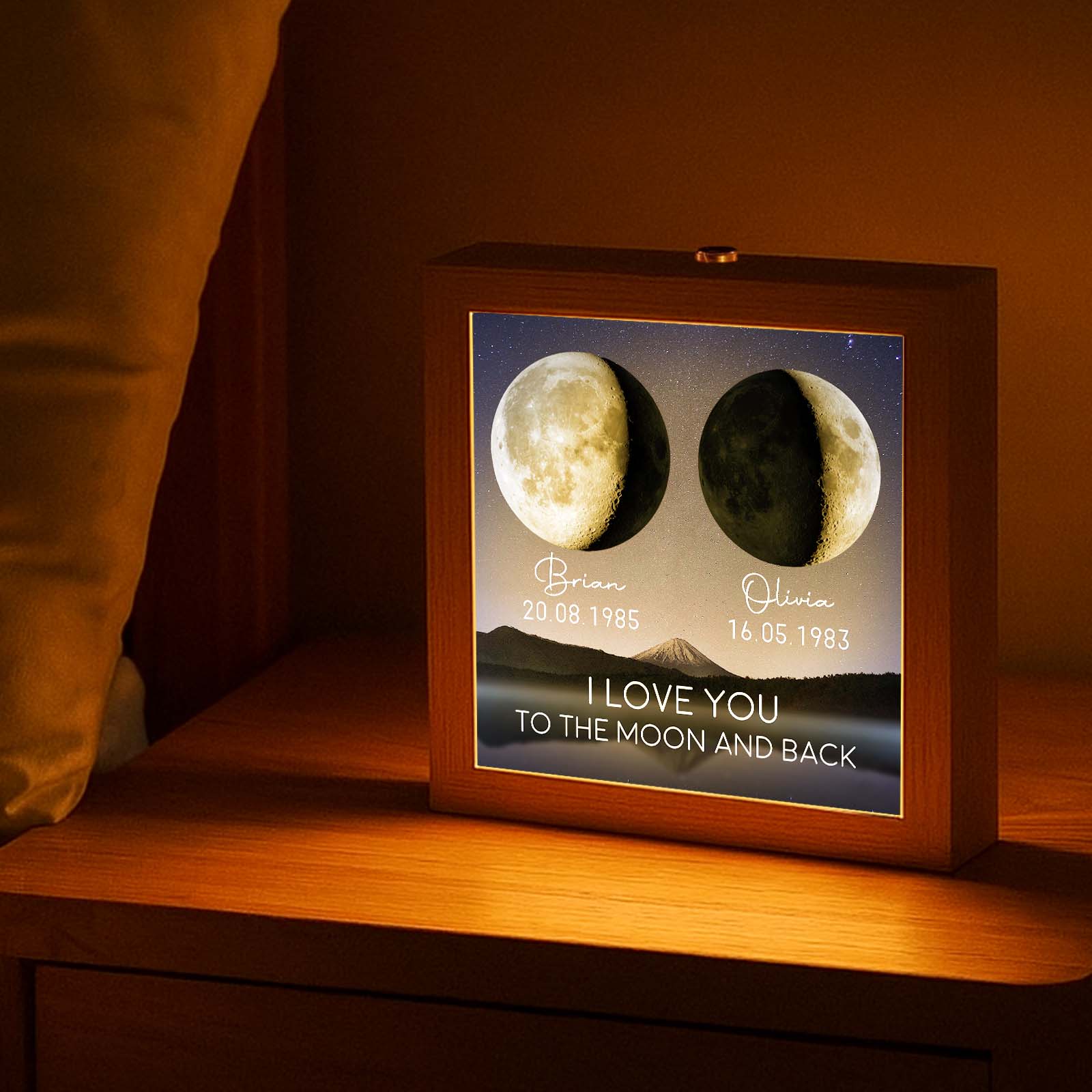 Custom couple lamp box gift featuring moon phase design and personalized names on a nightstand