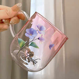 Custom floral glass mug gift featuring a pink design with purple flowers and personalized name
