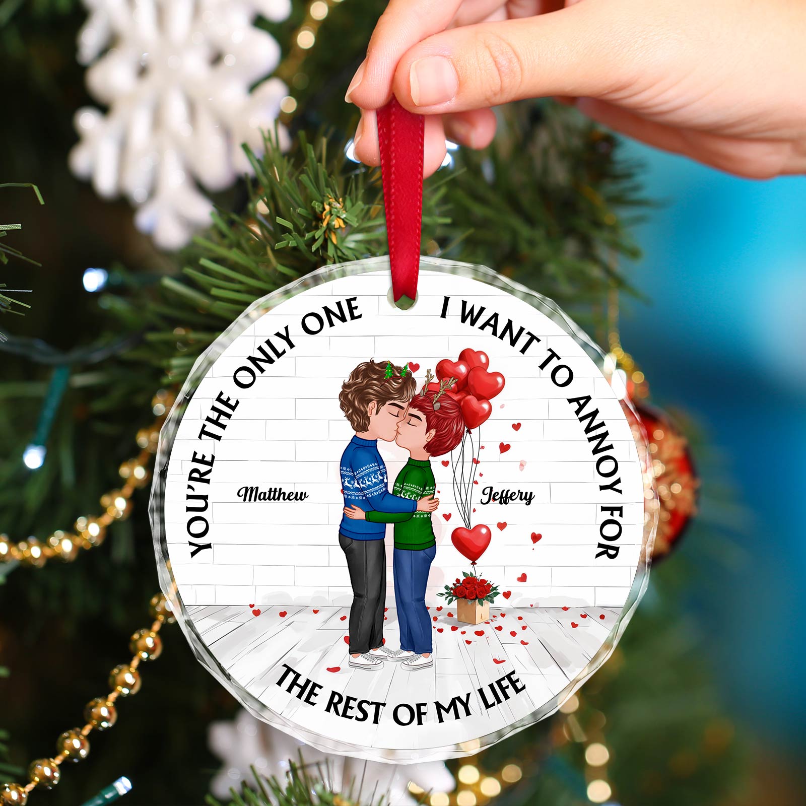 Personalized couple ornament with cartoon couple hugging and red heart balloons hanging on Christmas tree
