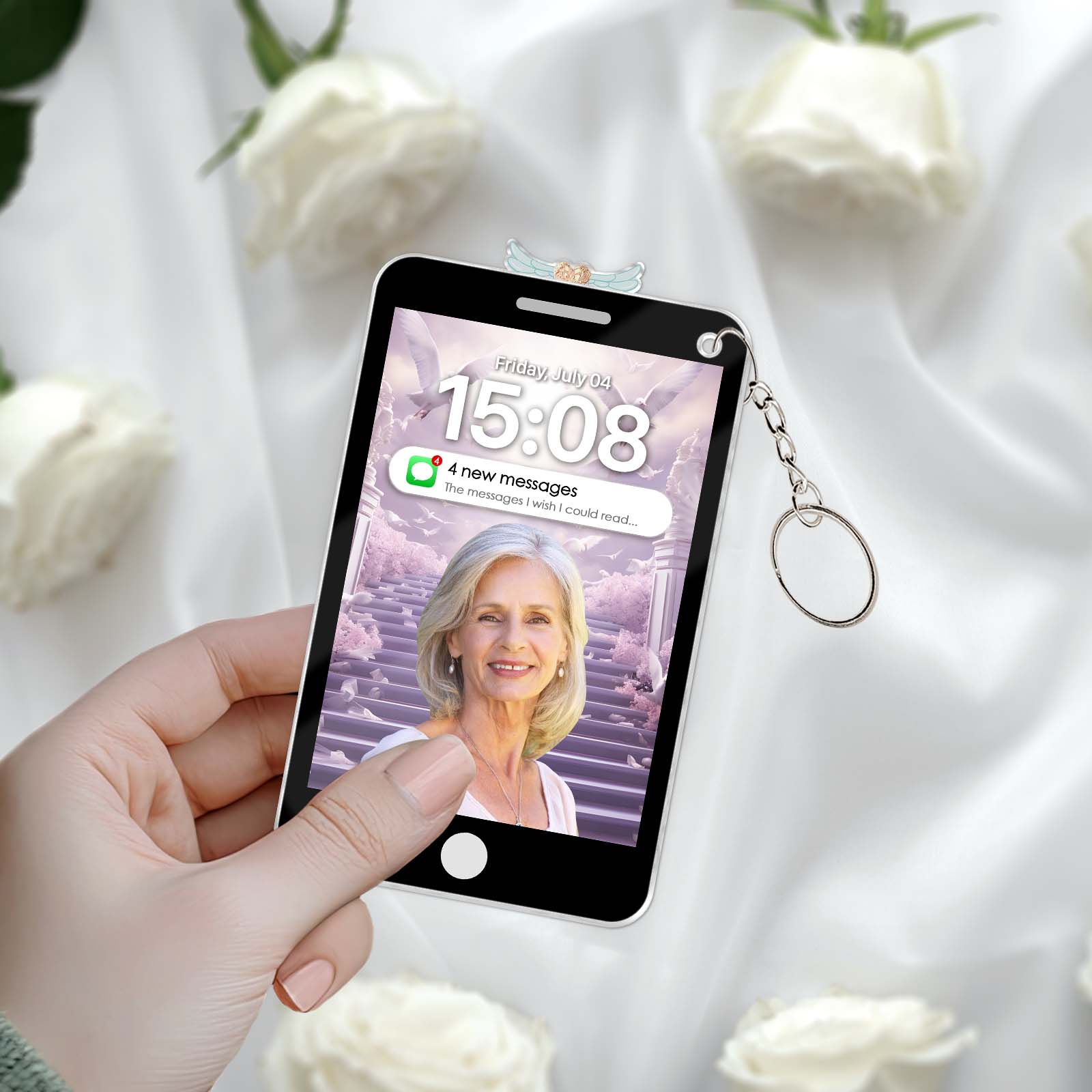 Hand holding a custom photo memorial keychain featuring a personalized image on a phone design