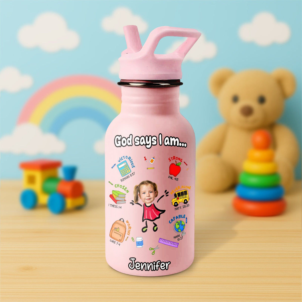 Pink Water Bottle For Kids with inspirational design and personalized name on a wooden table