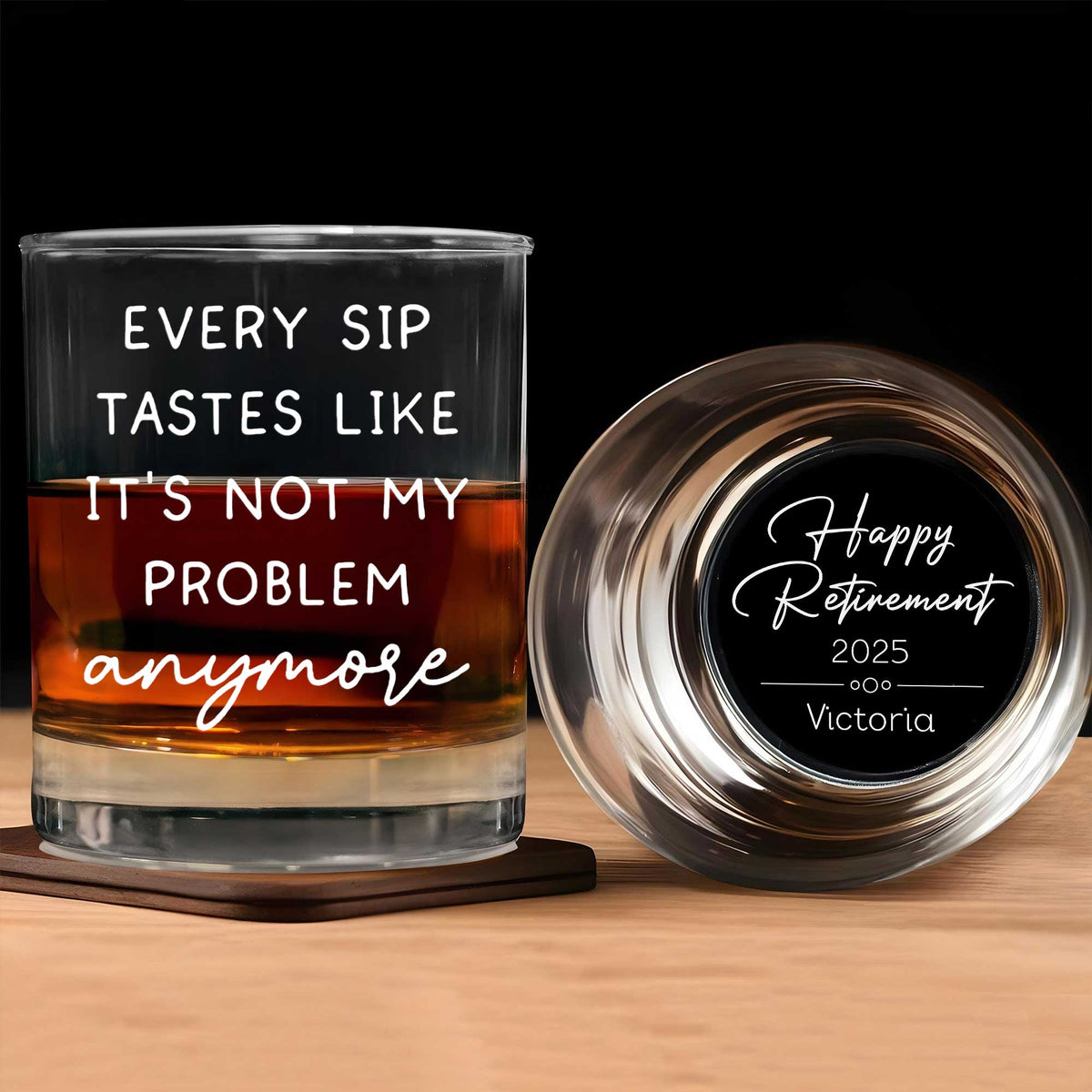 personalized retirement whiskey glass set showing one filled glass with humorous quote and one engraved Happy Retirement 2025 name