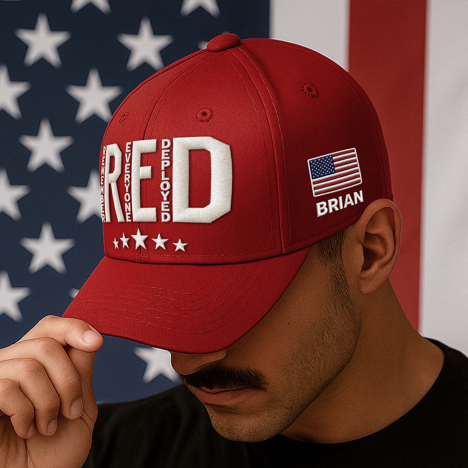 Red embroidered Remember Everyone Deployed cap with American flag detail for patriotic wearers