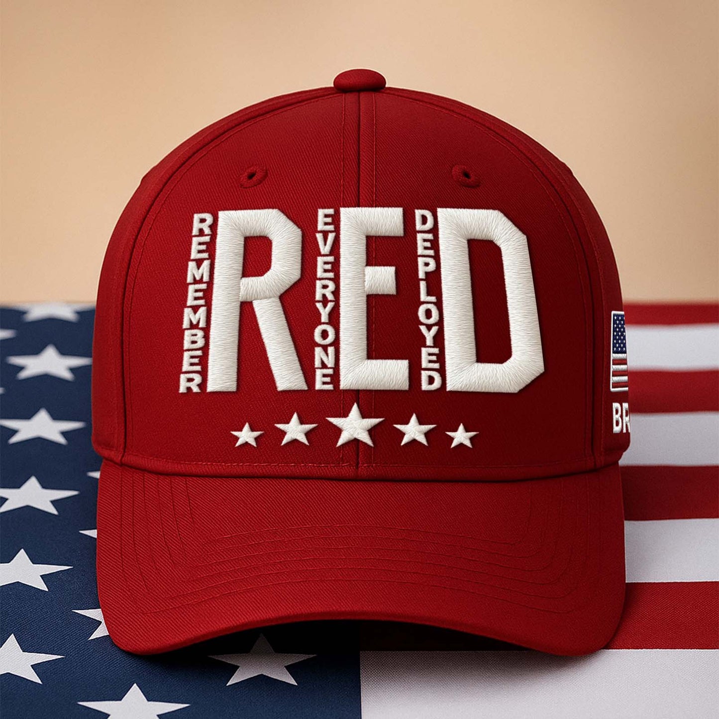 Embroidered Remember Everyone Deployed cap in red with stars and American flag detail