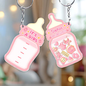 Family keepsake baby announcement keychain with pink bottle design and customizable date and name