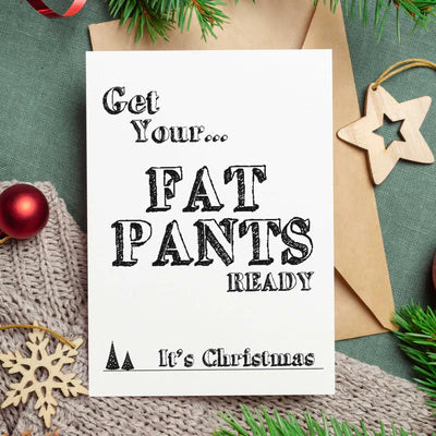 Funny Christmas card with Get Your Fat Pants Ready message surrounded by festive decorations