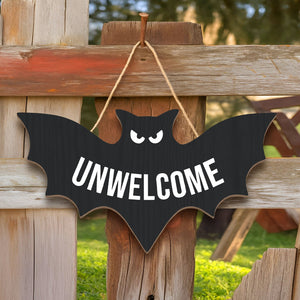 Funny Halloween door sign in bat shape with the word 'UNWELCOME' for spooky decorations