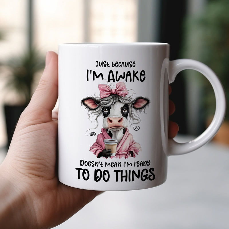 Funny personalized mug featuring a cow character with the text about being awake but not ready to do things