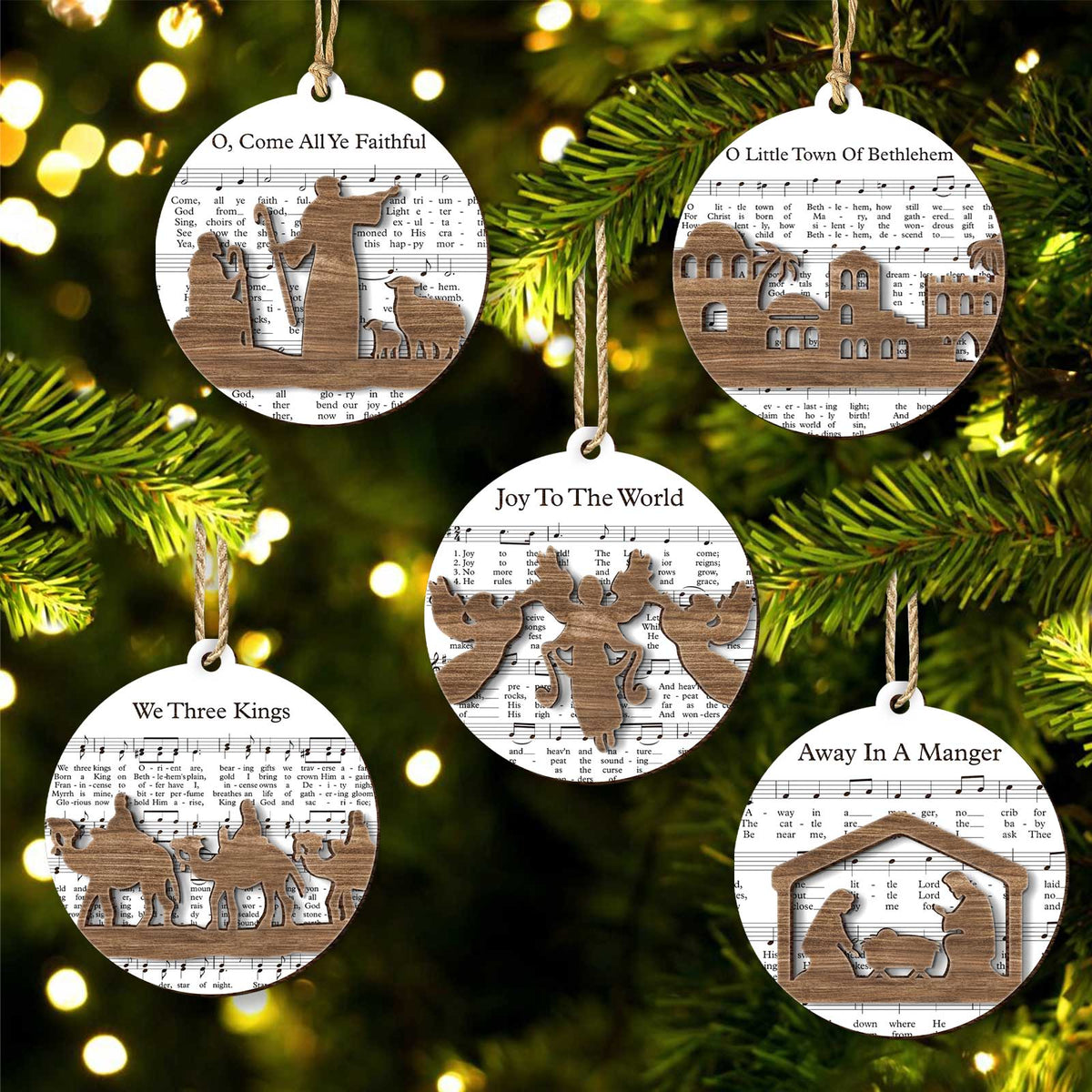365Gifty music sheet nativity ornament set with wooden nativity and holiday song designs hanging on Christmas tree