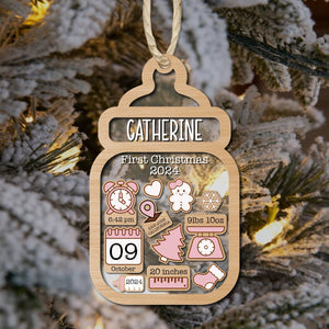 Personalized baby first Christmas ornament shaped like a baby bottle with name Catherine and birth details