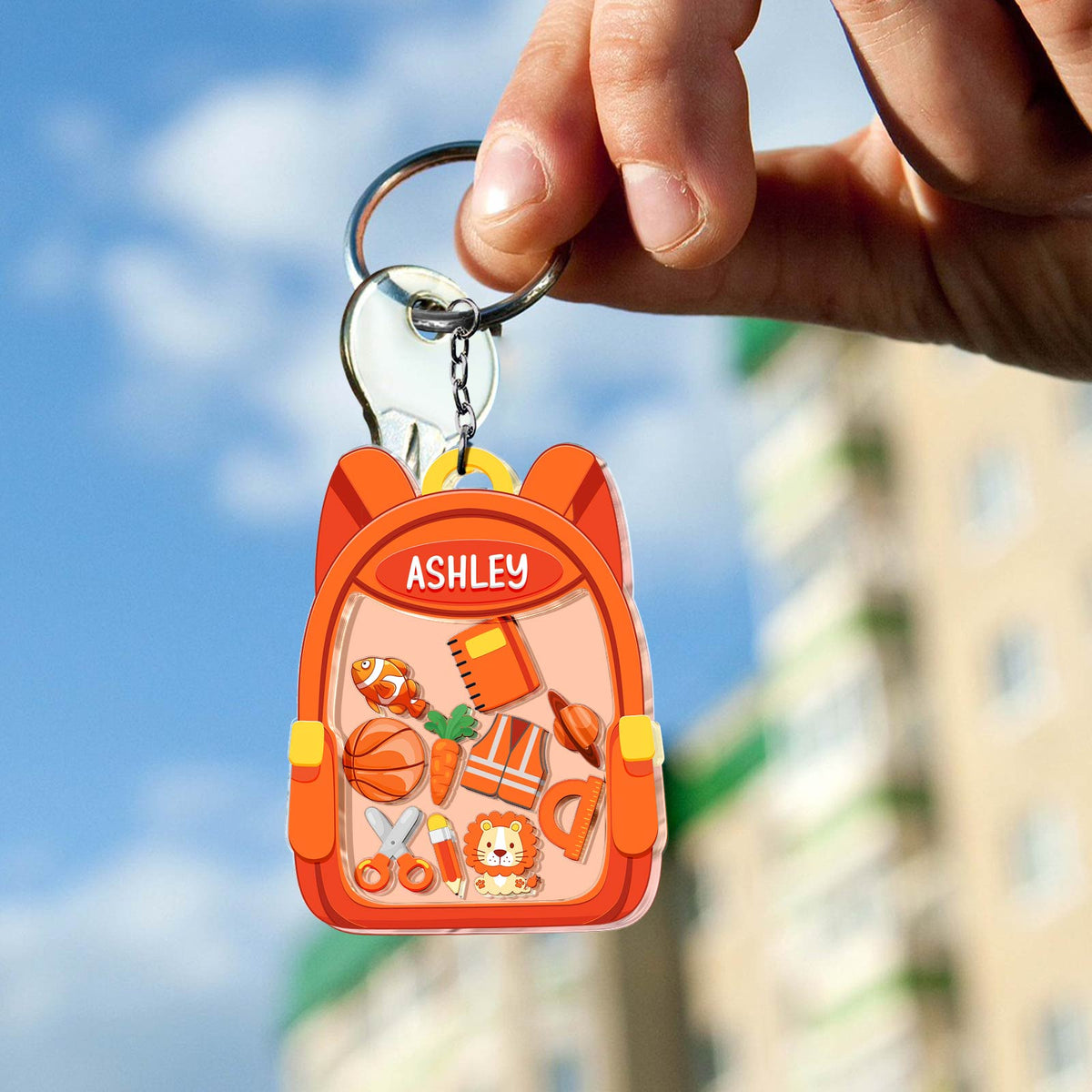 Personalized back to school keychain with a cute backpack design featuring school supplies