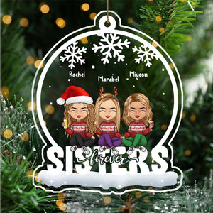 Personalized Christmas ornament with three cartoon sisters wearing holiday outfits and snowflakes design