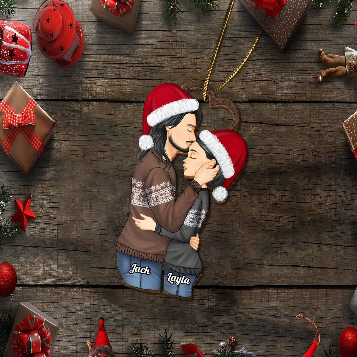Personalized couple Christmas ornament featuring a kissing couple wearing Santa hats and cozy sweaters with names Jack and Layla