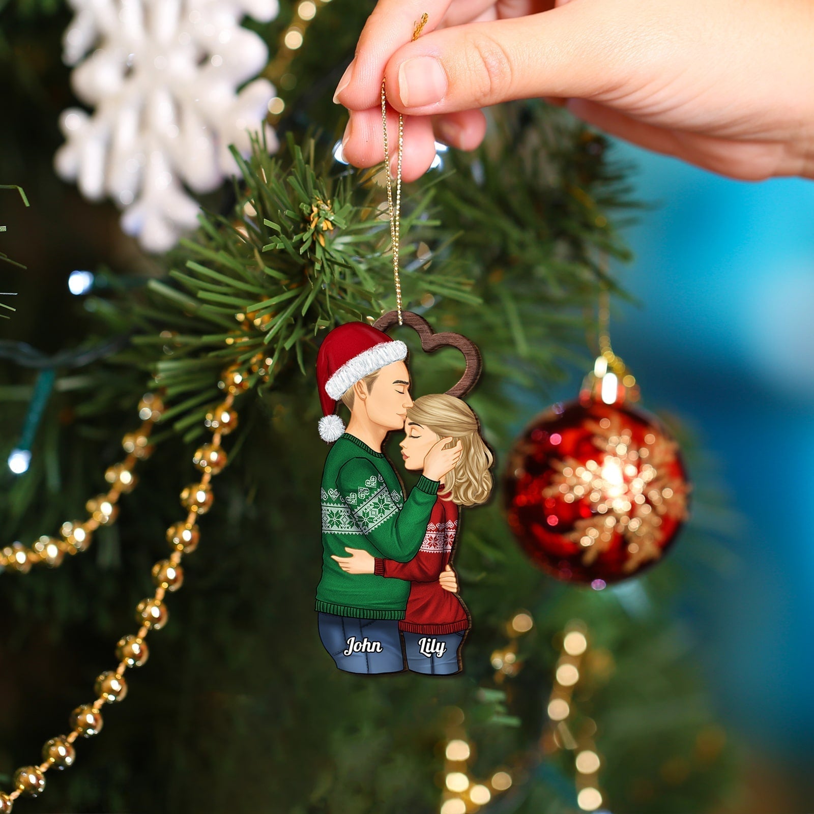 Personalized couple Christmas ornament showing a couple hugging and kissing by 365Gifty