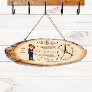 Personalized couple wooden clock with romantic love message and custom names hanging on wall