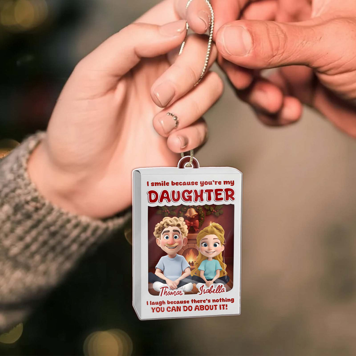 Personalized daughter ornament featuring a colorful design with the names Thomas and Isabella