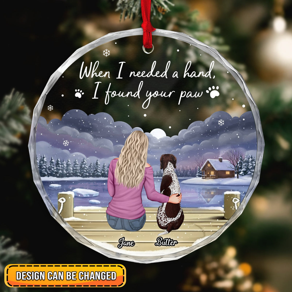 Personalized dog lover ornament featuring a woman with her dog by a lakeside cabin