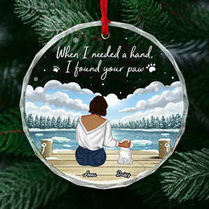Personalized dog lover ornament featuring a woman sitting with her dog by a snowy lake