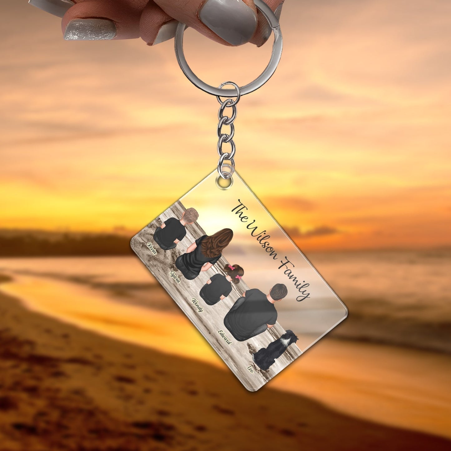Personalized family keychain with custom name design overlooking a beach sunset