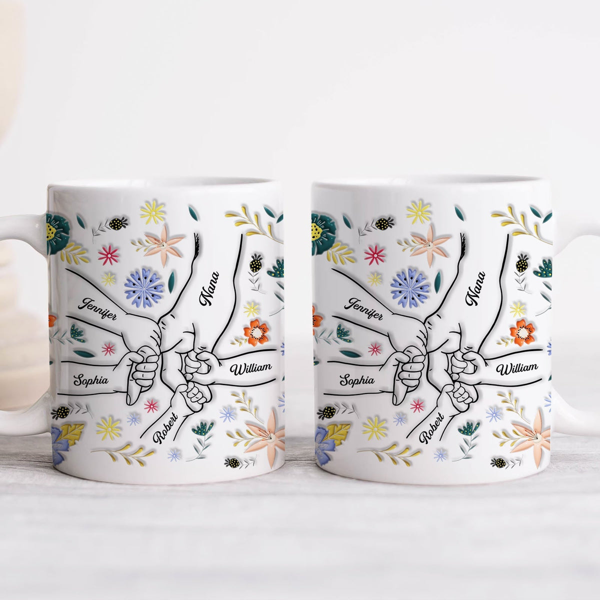 Personalized family mug featuring illustrated hands and floral designs with names