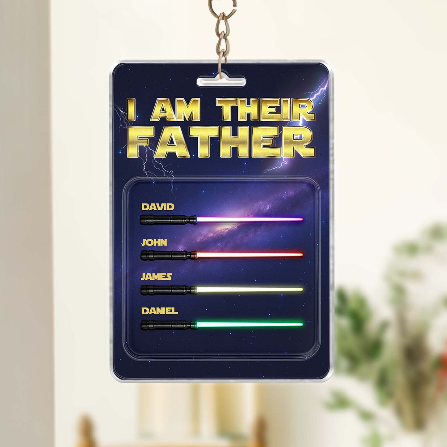 Personalized father keychain featuring names with colorful lightsaber design for a unique gift