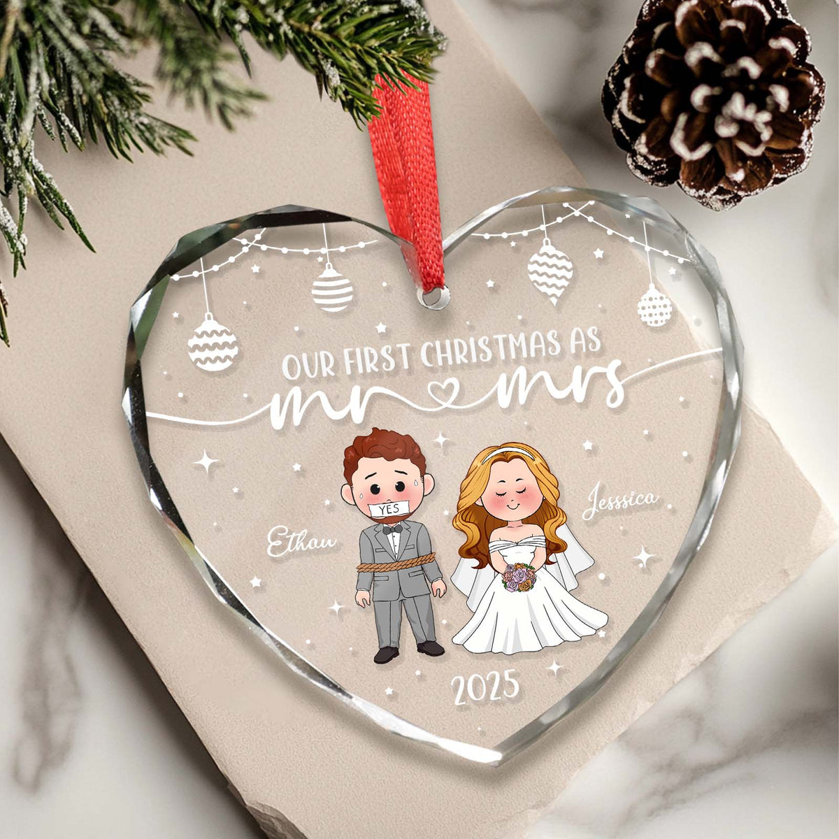 Personalized first Christmas ornament in heart shape featuring a bride and groom with names and date