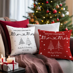 Personalized first Christmas pillow set with Mr and Mrs design in white and red on couch near Christmas tree
