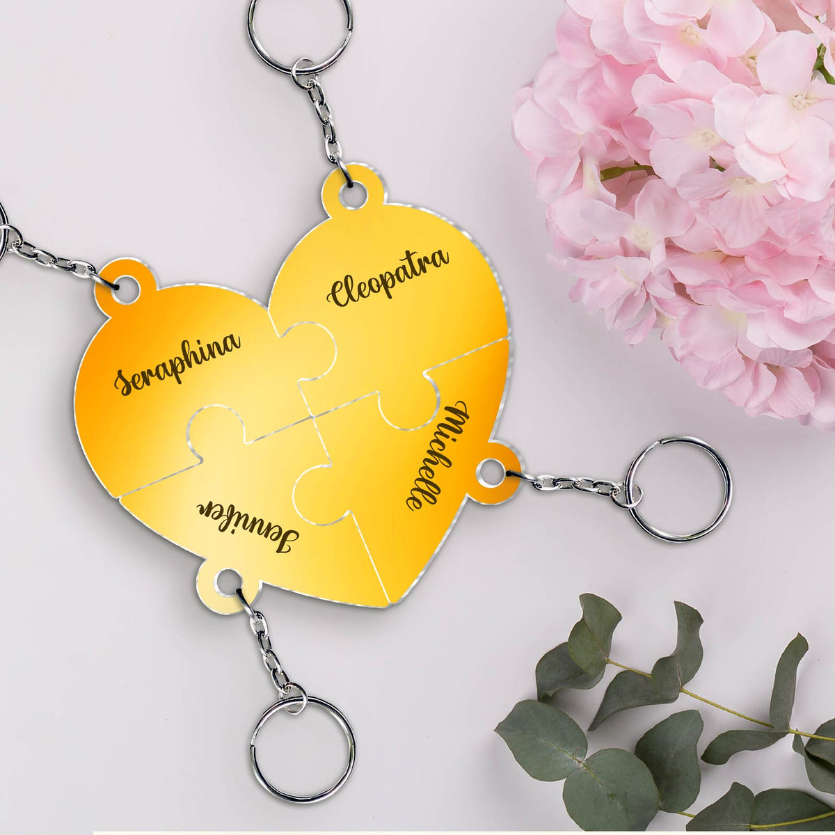 Personalized friendship keychain in a heart-shaped puzzle design with names engraved