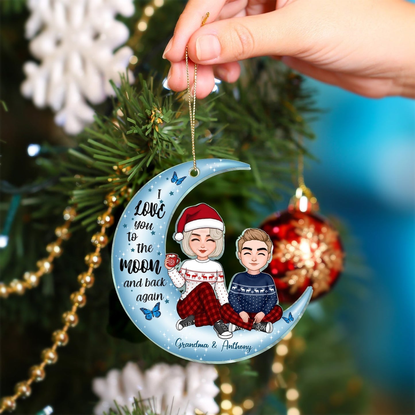 Personalized grandma and grandkid ornament featuring a festive design with a moon and festive attire