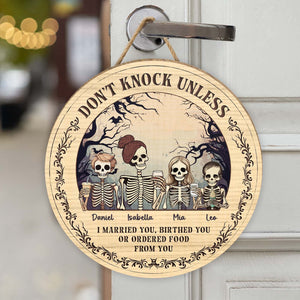 Personalized Halloween wooden door sign featuring skeletons and playful text for festive decor
