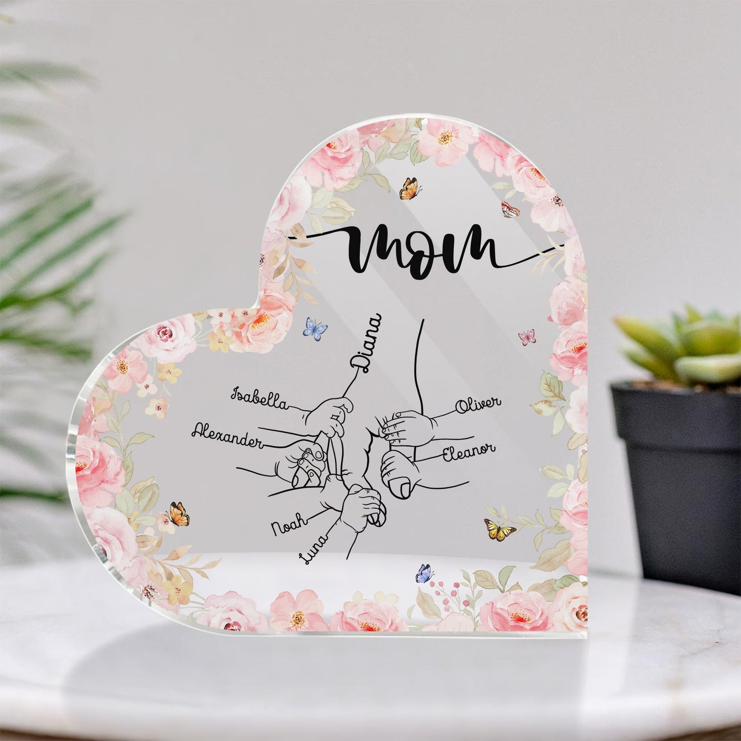 Personalized mom acrylic plaque featuring family names with floral design and heart shape