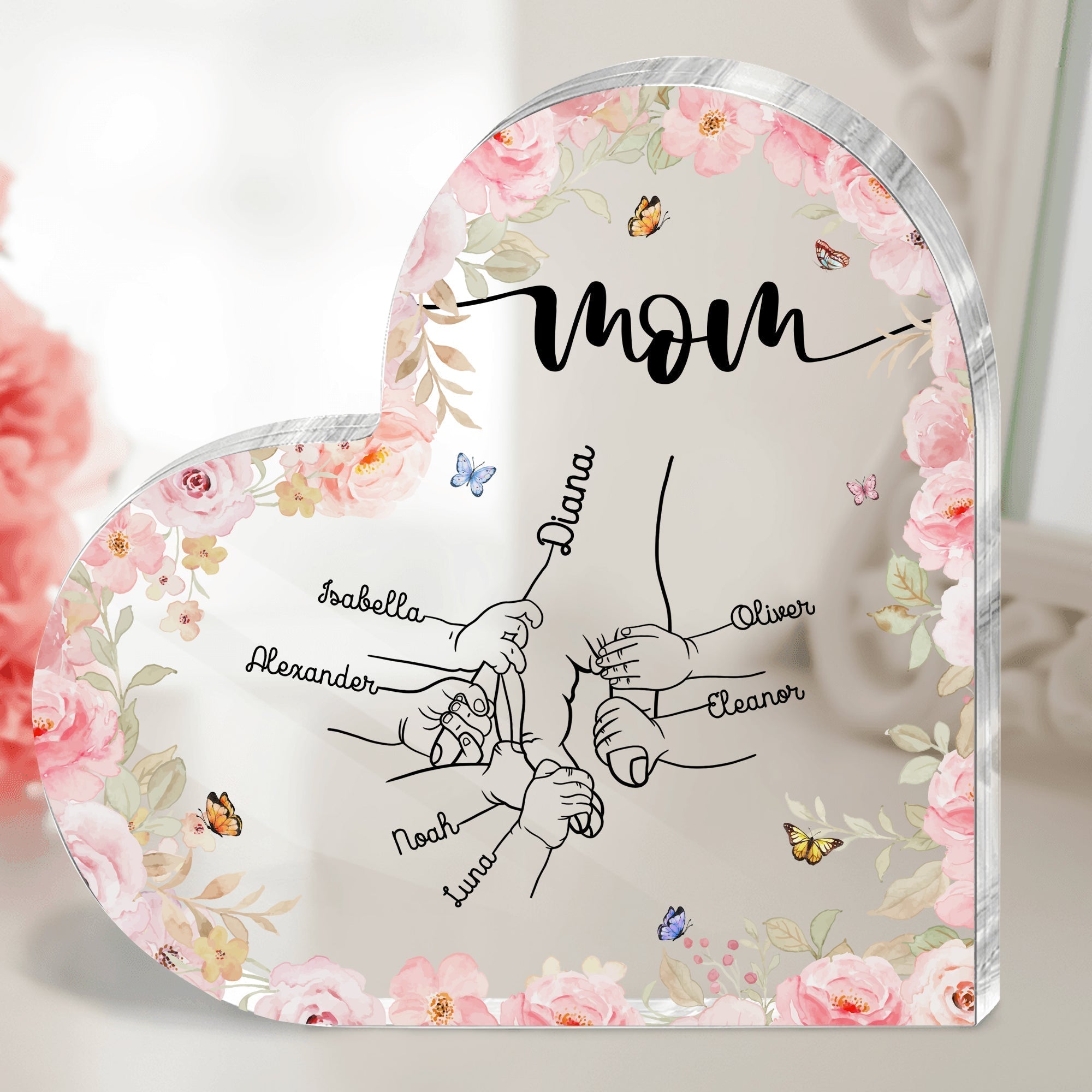Personalized mom acrylic plaque with floral design showcasing family names in heart shape