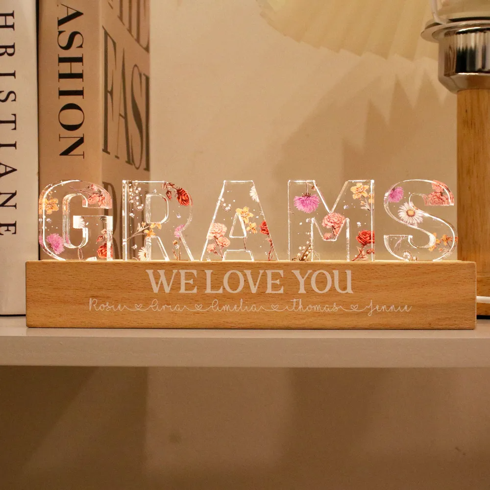 Personalized mom birth LED light with a wooden base and colorful floral design spelling Grams