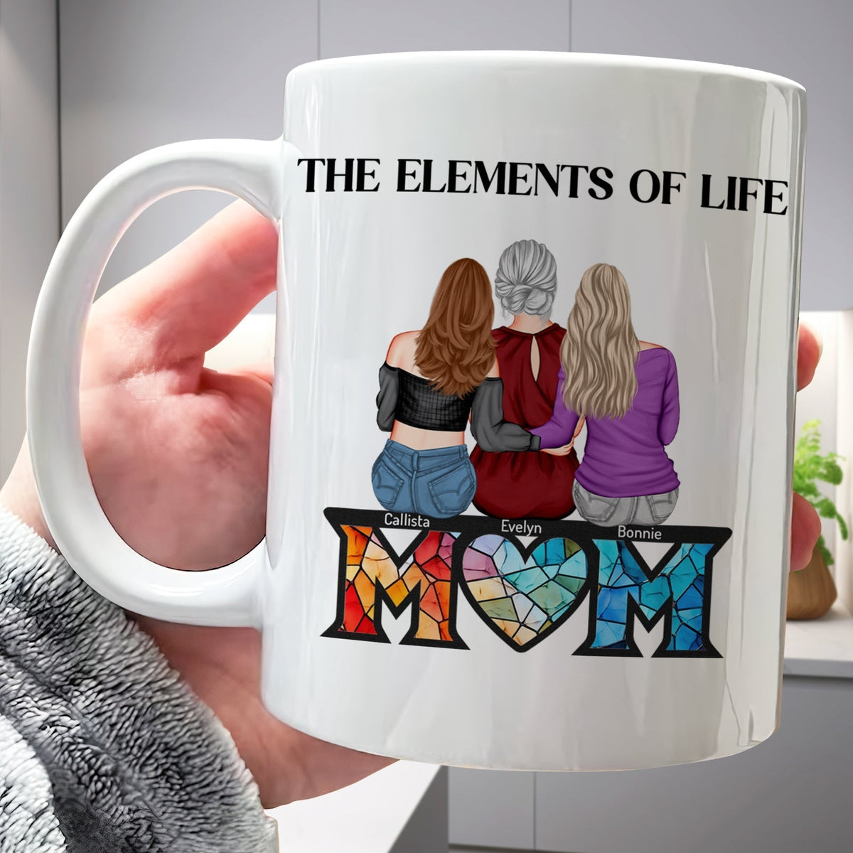 Personalized mom mug featuring a colorful design with the word MOM and three women representing friendship